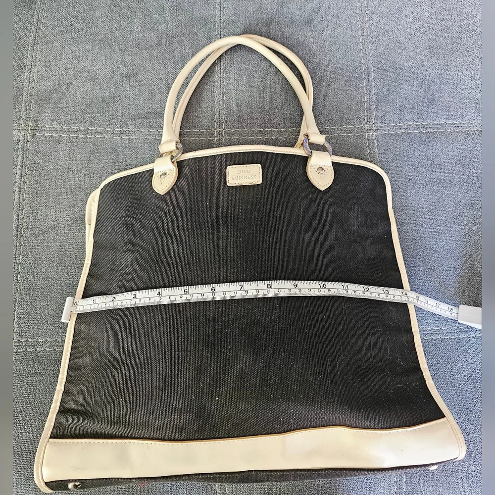 Elegant Lulu Guinness black canvas and beige leather trim shoulder bag